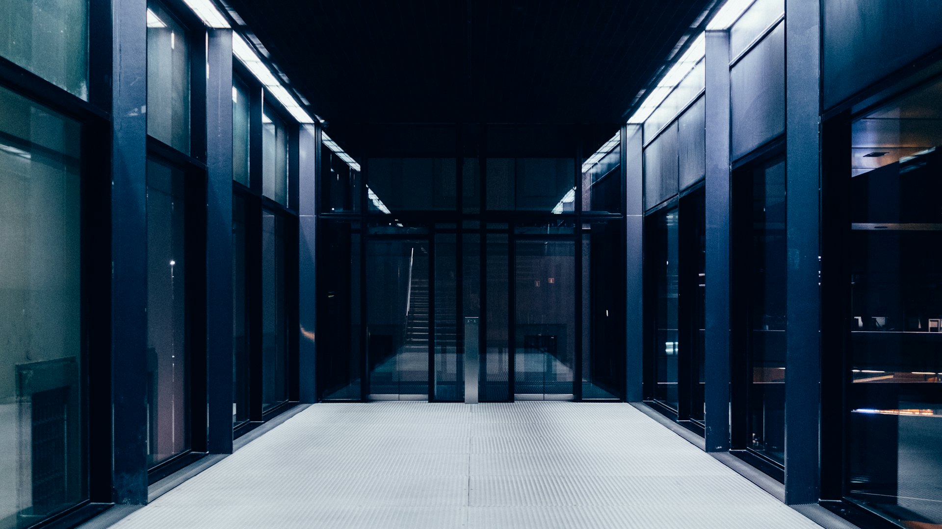 Long aisle between server racks inside a data center